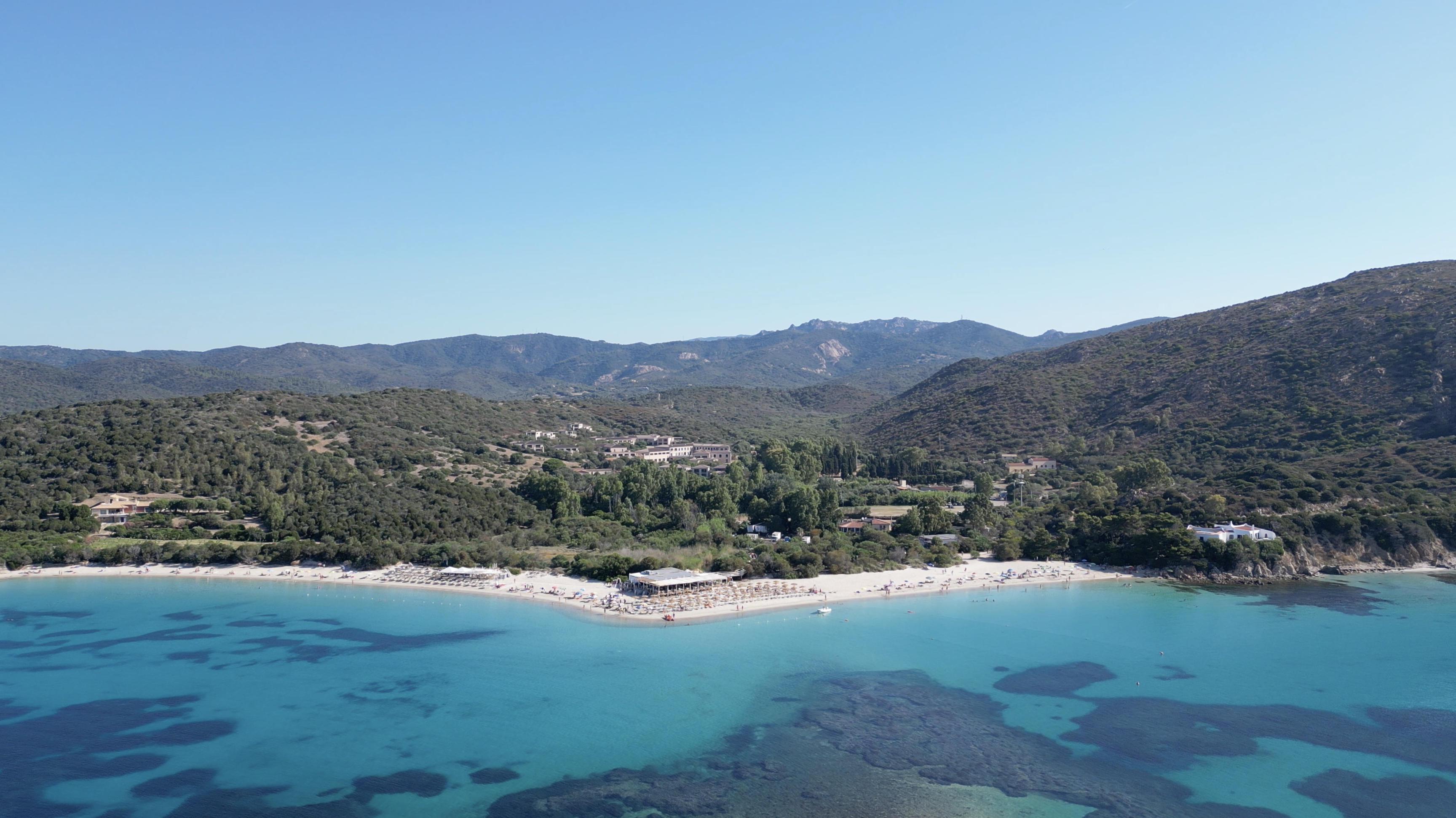 Tuerredda Bay: A Sardinian gem. Crystal-clear turquoise waters, sandy beach, and breathtaking scenery. Perfect for sunbathing and swimming.